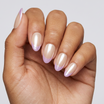 Hand with pink and white gradient nail polish on a light gray background